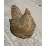 A weathered terracotta garden ornament of a hen, 13" high