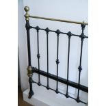 A Victorian metal and brass bed head, painted black