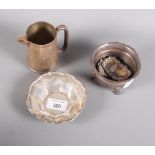 A silver christening mug (now converted to a jug), a silver sugar bowl, a silver bonbon dish and