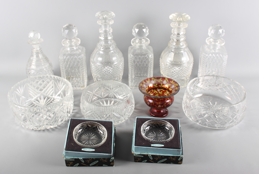 A set of three square glass spirit decanters, a pair of 19th Century decanters decorated diamond and