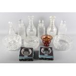 A set of three square glass spirit decanters, a pair of 19th Century decanters decorated diamond and