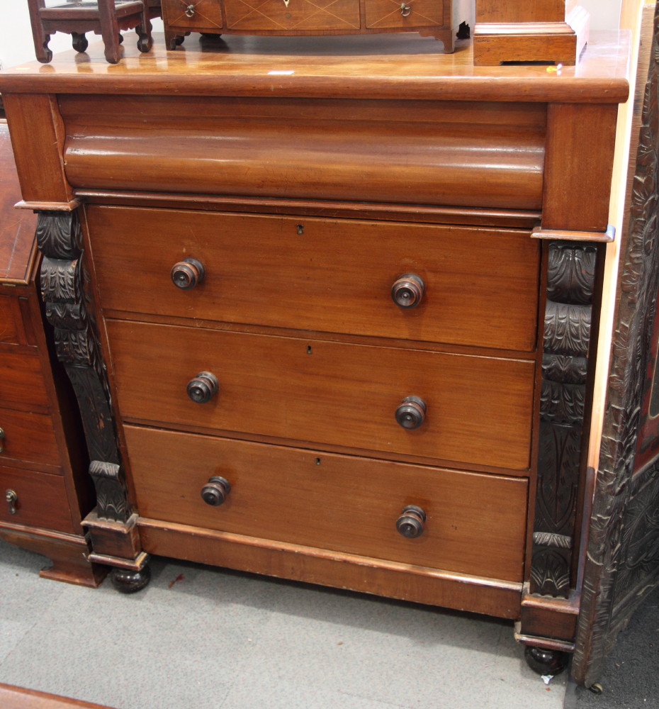 A Victorian mahogany chest of four long drawers with carved pilasters, 42" wide