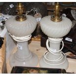 A pair of Victorian style white glass table lamp bases, 10" high (now converted to electricity)