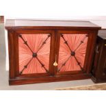 A Regency rosewood side cabinet enclosed two panel doors inset pleated pink fabric, 54" wide