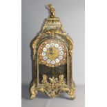 A late 18th Century French mantel clock in Boulle decorated case with ornate ormolu mounts having
