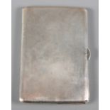 A silver cigarette case with engine turned decoration, 4.8oz troy approx