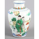 A Chinese porcelain famille verte figure decorated vase, 7 1/4" high