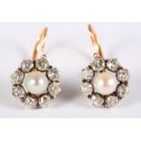 A pair of 19th Century gold, diamond and pearl cluster earrings, each set with eight old cut