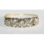 An Edwardian gold and diamond five stone dress ring, size J