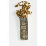 A 9ct gold ingot and chain, 17.5g