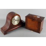 A stained as mahogany stationery box with hinged top and fall front and a mantel clock in "