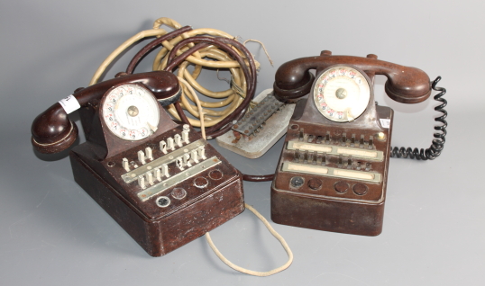 Two French exchange telephones, in brown plastic cases
