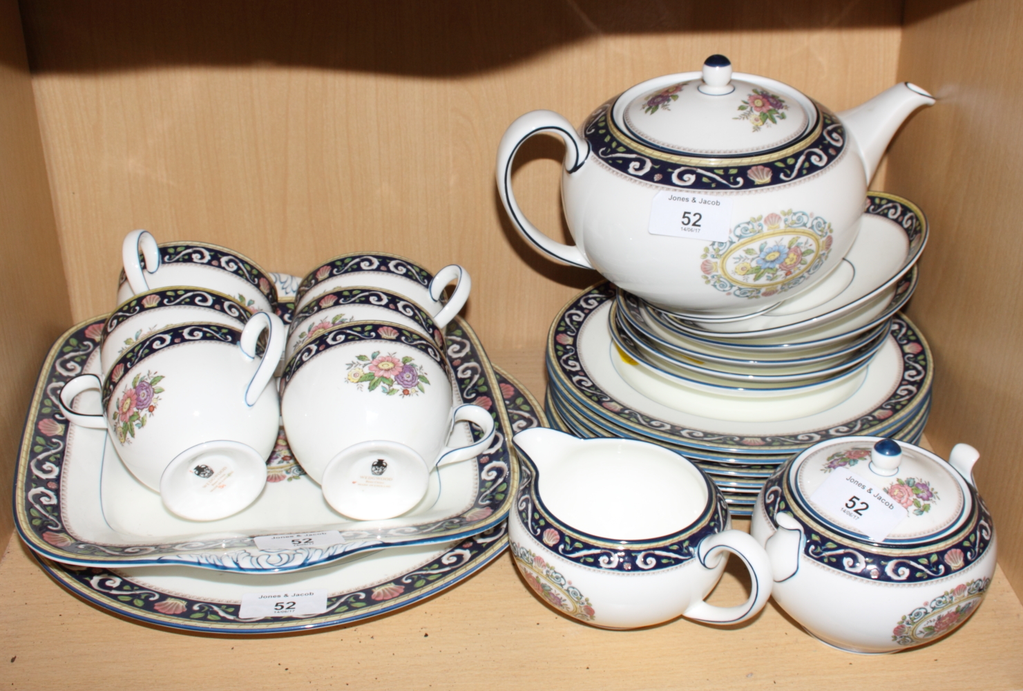 A Wedgewood "Runnymede" porcelain teaset comprising teapot, sugar and cream, six cups, five saucers,