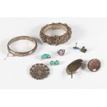 A filigree bangle decorated flowers, an engraved silver bangle, a turquoise brooch and earring