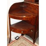 A George III mahogany two-tier corner washstand