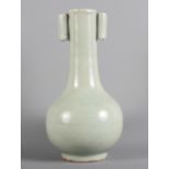 A 19th Century pottery celadon vase, 6 1/2" high