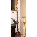 A giltwood standard lamp, on circular base