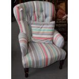 A Victorian style nursing chair, upholstered in a multi-coloured striped fabric