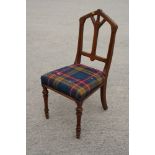 A late 19th Century oak standard chair with Gothic style back and stuffed over seat upholstered in a