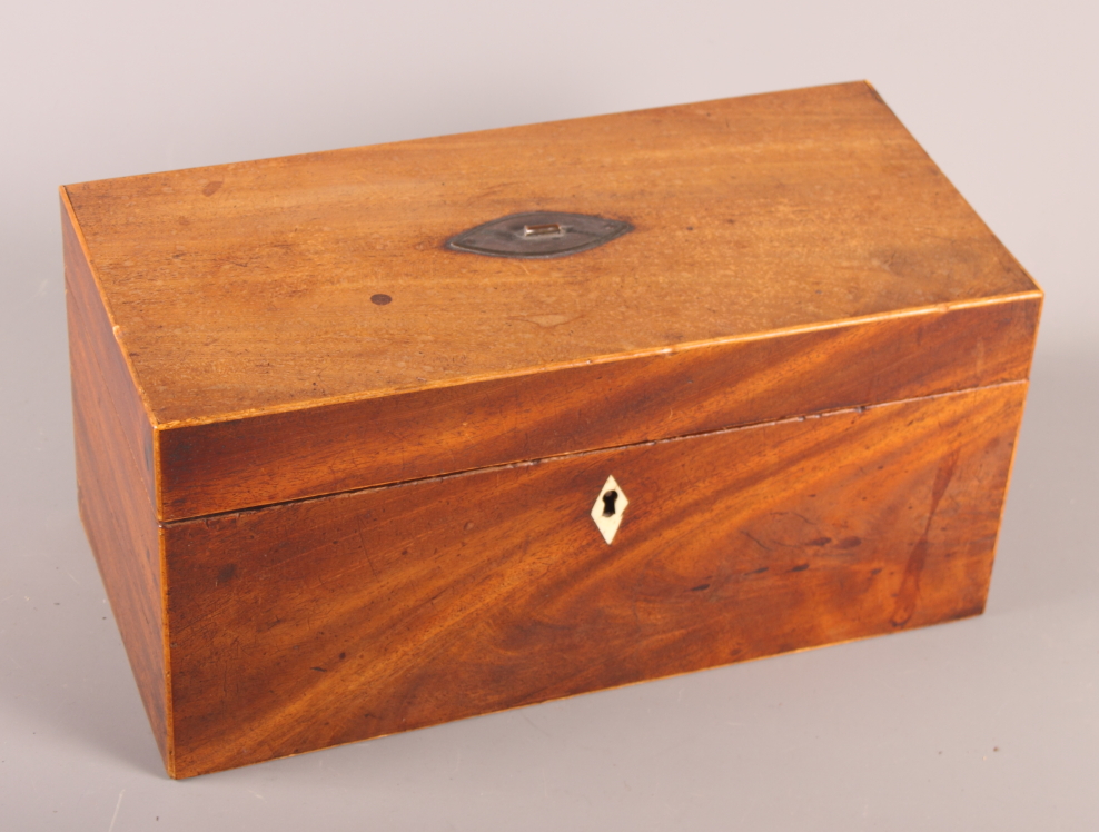 An 18th Century mahogany tea caddy (interior missing), 12" wide