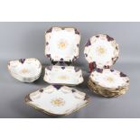 An early 20th Century Wedgwood dessert service with navy, gilt and floral decoration (14 pieces