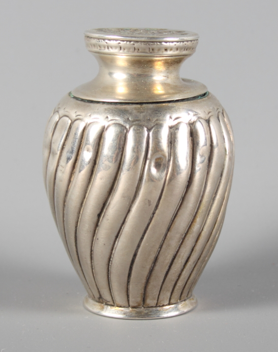 A Victorian silver pounce pot with spiral fluted decoration