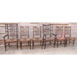 A set of four 18th Century style rush seat dining chairs, the backs decorated two rows of