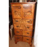 A grained as burr walnut cabinet, fitted cupboard and four drawers below, 24" wide
