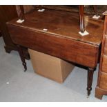 A William IV mahogany Pembroke table, fitted dummy drawers, on turned and reeded supports, 42" long