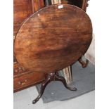 An 18th Century circular tilt top occasional table, on tripod base, 29" dia