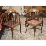 A pair of late 19th Century mahogany corner chairs with inlaid top rails, on cabriole supports