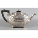 A silver melon shaped teapot with ebonised knop and handle, 23.5oz troy approx