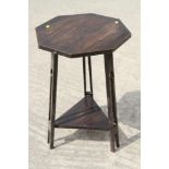 A Liberty style Arts & Crafts oak octagonal top occasional table, on pierced splay supports, 18"