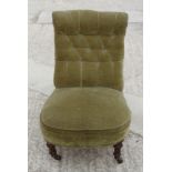 A Victorian mahogany nursing chair, upholstered in a green Dralon, on turned and castored supports