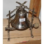 A 19th Century silver plated bell-shaped dinner gong, on naturalistic stand