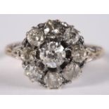 An old cut diamond cluster ring with gold mount
