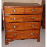 A 19th Century mahogany chest of two short and three long drawers with oval brass handles, on