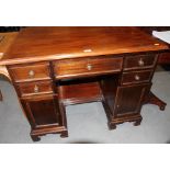A 19th Century mahogany twin pedestal writing table, fitted five drawers and two cupboards, on