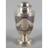 A silver sugar dredger with pierced and engraved Neo-Classical decoration and blue glass liner