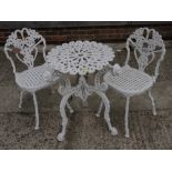 A pair of white painted cast aluminium garden chairs and a similar table