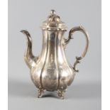 A Victorian silver coffee pot with engraved decoration raised on four cast feet, 26oz troy approx