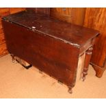 A 19th Century rectangular mahogany drop leaf dining table, on turned supports, 48" x 19", extending