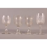 A pair of 19th Century engraved glass goblets and two other 19th Century engraved glass goblets,