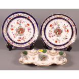 A Dresden china inkstand with two inkwells (one damaged), a pair of Samson armorial china plates and