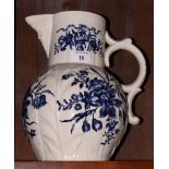 An 18th Century Worcester china jug, body moulded leaves with blue floral decoration, crack to