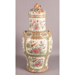 A Cantonese famille verte decorated vase with domed lid having Kylin surmount, 19" high and a