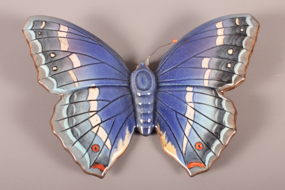 A Beswick model "Purple Emperor" butterfly, 6" wide (one antenna missing)