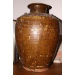 A Chinese stoneware brown glazed storage jar with ring handles, 19 1/2" high (surface damages)