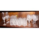 A suite of crystal drinking glasses comprising six wines and two sets of tumblers, in sizes, etc