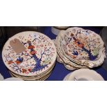 A 19th Century Derby china dessert set decorated in red, blue and gilt, comprising seven dessert